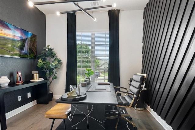 office featuring hardwood / wood-style floors and a healthy amount of sunlight