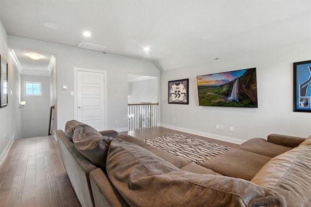 living room with hardwood / wood-style flooring and crown molding