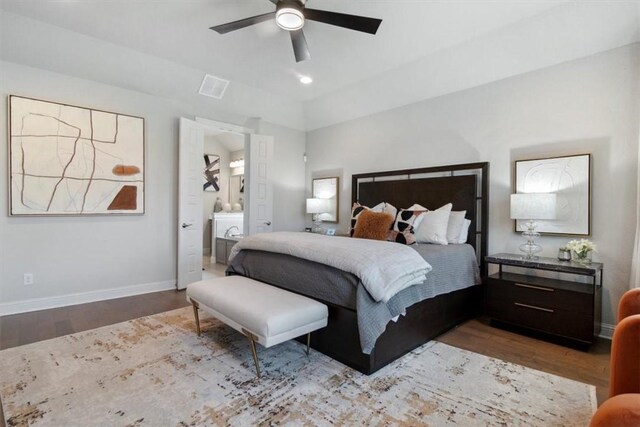 bedroom featuring hardwood / wood-style flooring, ceiling fan, and ensuite bathroom