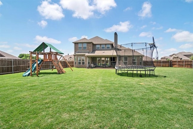 exterior space with a playground and a trampoline