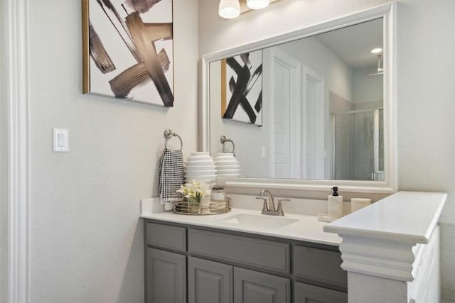 bathroom with vanity and an enclosed shower