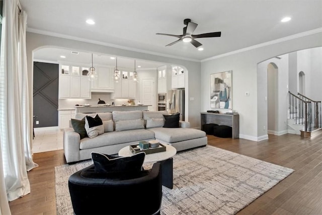 living room with hardwood / wood-style floors and ornamental molding