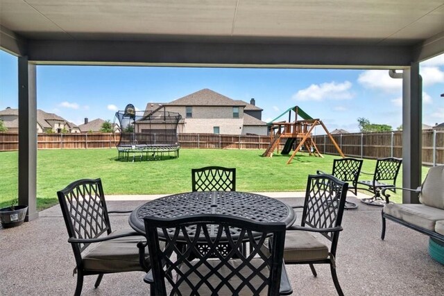 view of patio / terrace featuring a playground and a trampoline