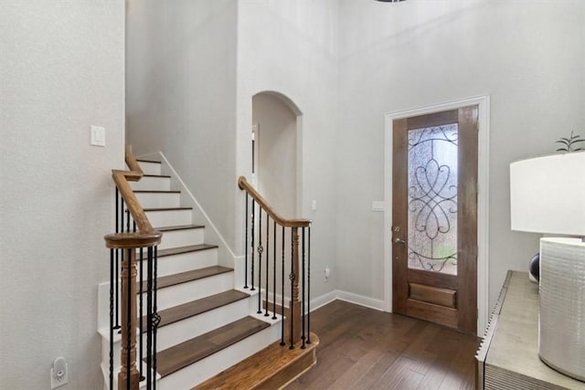 entryway with dark hardwood / wood-style floors