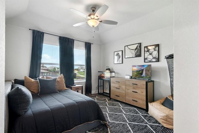 bedroom featuring ceiling fan and lofted ceiling