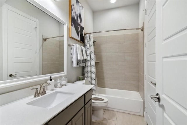 full bathroom with tile patterned floors, vanity, shower / bath combination with curtain, and toilet