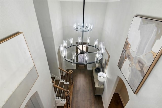 interior space with a chandelier and hardwood / wood-style floors