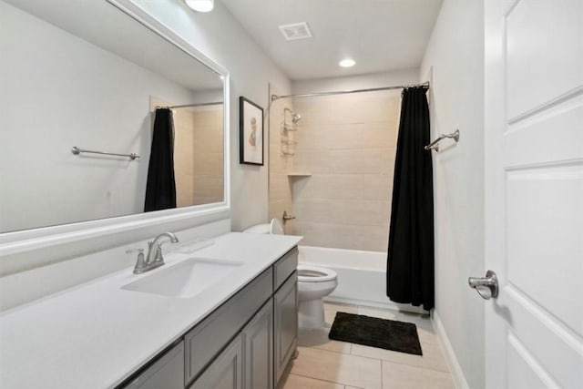 full bathroom with toilet, shower / tub combo, vanity, and tile patterned floors