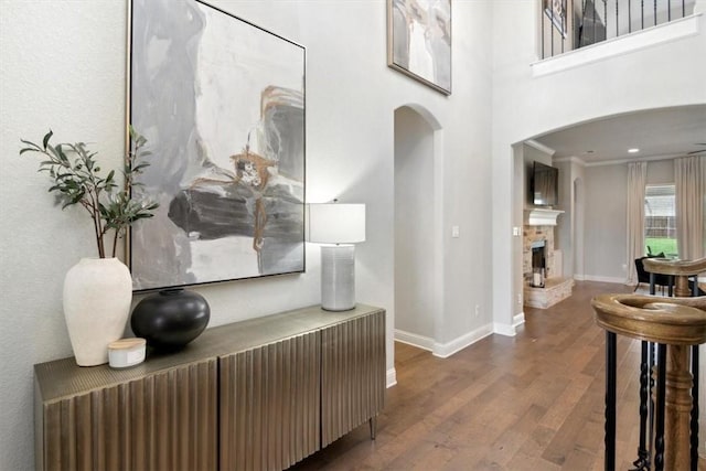 corridor featuring crown molding and hardwood / wood-style floors