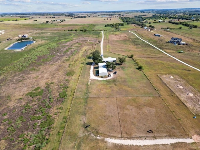 drone / aerial view featuring a rural view and a water view