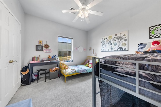 carpeted bedroom with a closet and ceiling fan