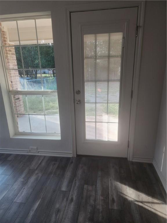 entryway with dark hardwood / wood-style floors