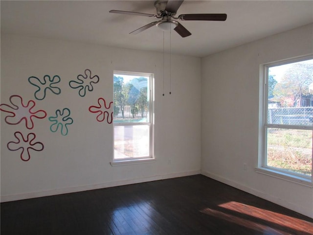 unfurnished room featuring dark hardwood / wood-style floors and ceiling fan