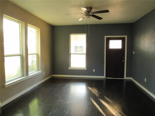 foyer with ceiling fan and dark hardwood / wood-style flooring