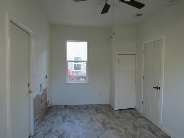 spare room featuring ceiling fan