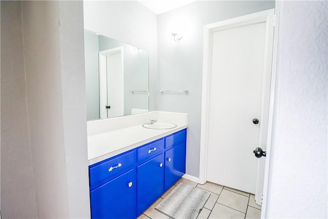 bathroom featuring tile patterned flooring and vanity