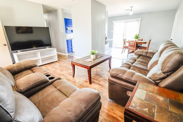 living room with wood finished floors and baseboards