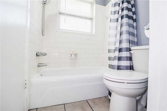 full bath with shower / bath combo with shower curtain, toilet, and tile patterned floors