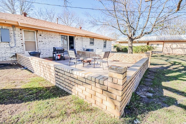 exterior space featuring an outdoor fire pit and area for grilling