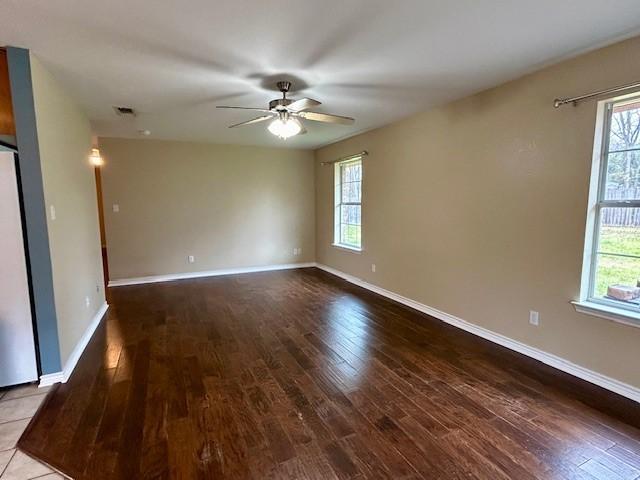 unfurnished room featuring hardwood / wood-style flooring and ceiling fan