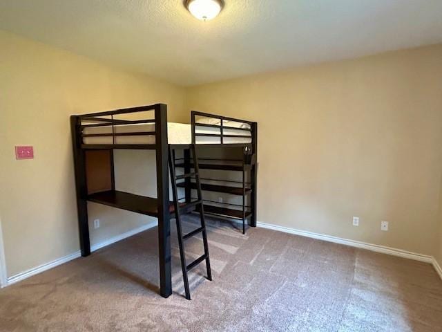 unfurnished bedroom with carpet flooring