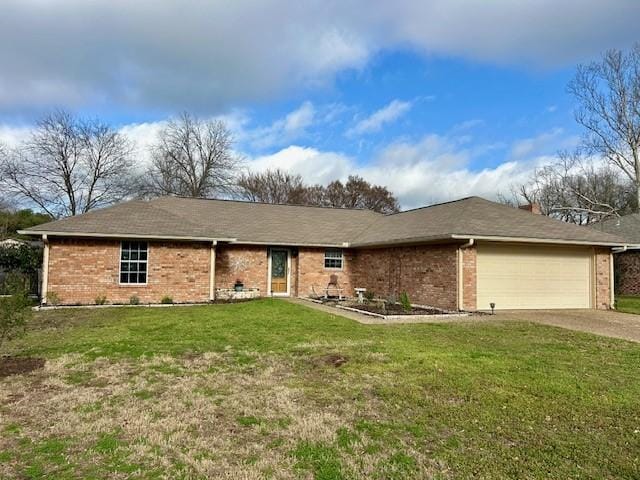 ranch-style house with a garage and a front lawn