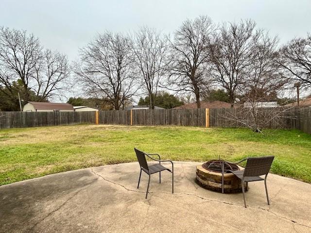 view of patio / terrace with a fire pit