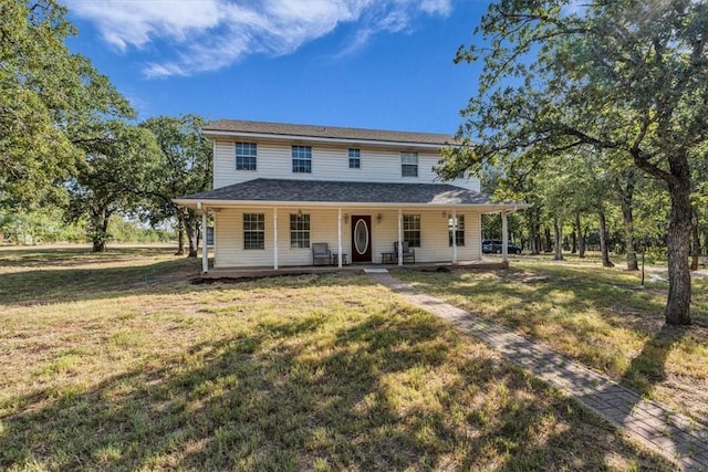 farmhouse inspired home with a porch and a front yard