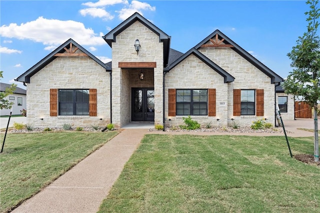 view of front of house with french doors and a front yard