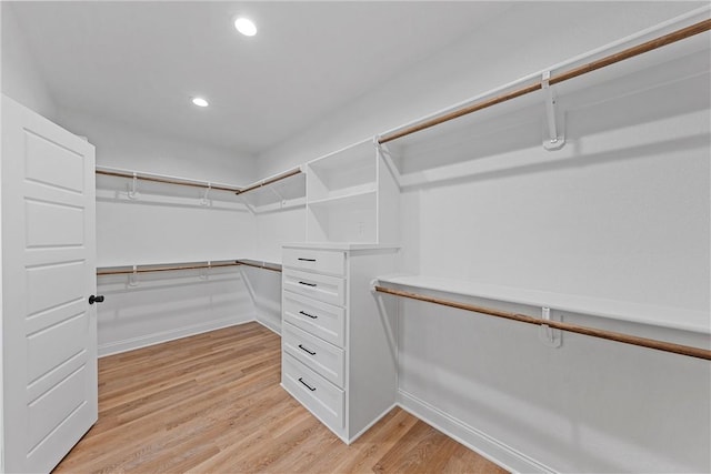 walk in closet featuring light hardwood / wood-style floors