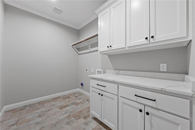 washroom featuring washer hookup, cabinets, hookup for an electric dryer, light hardwood / wood-style flooring, and ornamental molding