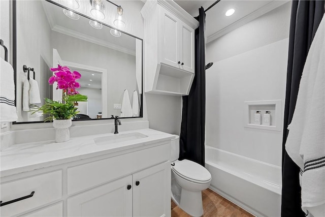 full bathroom featuring shower / bath combo, vanity, crown molding, wood-type flooring, and toilet