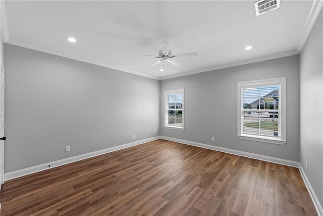 unfurnished room featuring hardwood / wood-style floors, plenty of natural light, ornamental molding, and ceiling fan