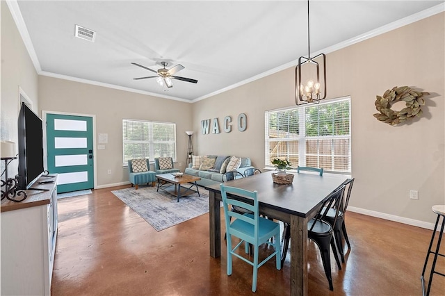 dining space featuring crown molding, concrete floors, and ceiling fan with notable chandelier