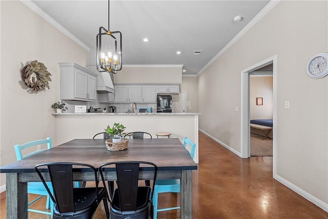 dining area with crown molding and a chandelier