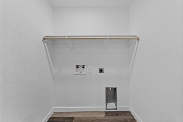 clothes washing area with hookup for a washing machine, dark hardwood / wood-style flooring, and electric dryer hookup