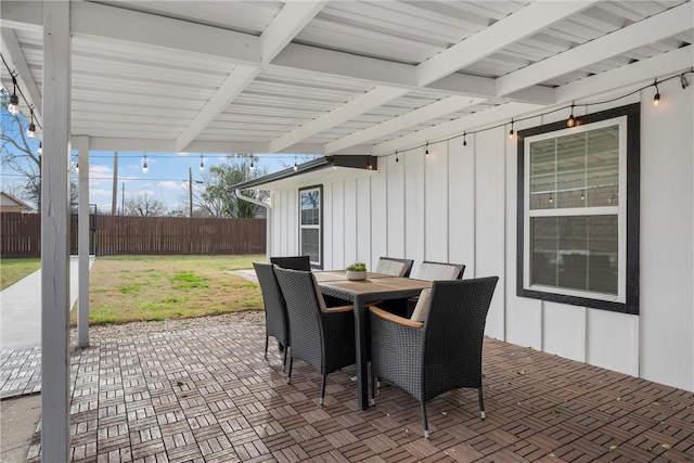 view of patio / terrace featuring outdoor dining space and fence