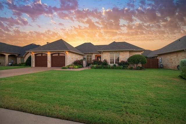 view of front of property with a lawn and a garage