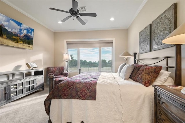 bedroom with carpet floors, ceiling fan, and crown molding