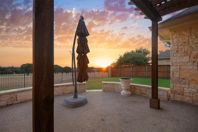 patio terrace at dusk with a yard