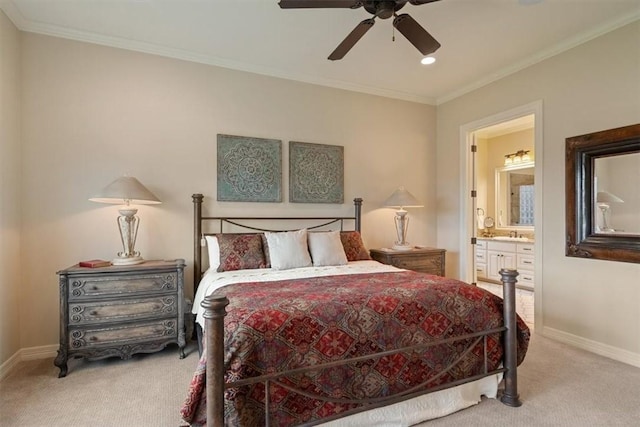 carpeted bedroom with connected bathroom, ceiling fan, ornamental molding, and sink