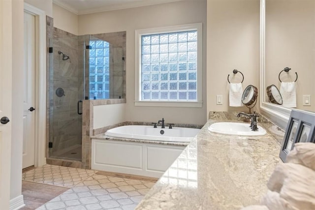 bathroom featuring hardwood / wood-style floors, vanity, crown molding, and independent shower and bath