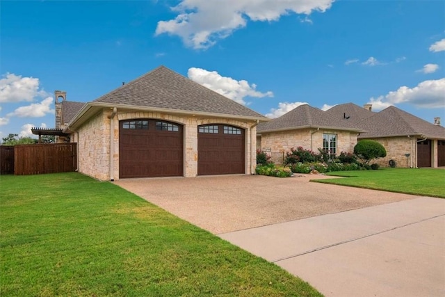 view of front of home featuring a front lawn and a garage