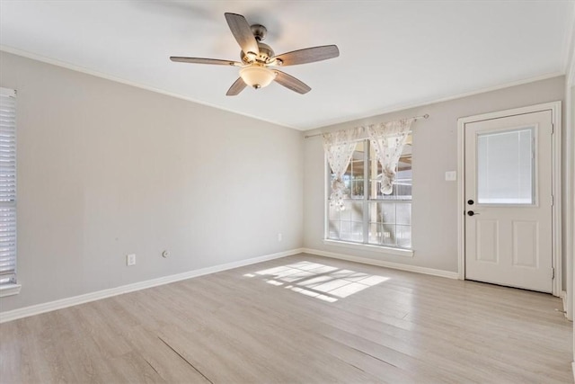 empty room with ceiling fan, ornamental molding, and light hardwood / wood-style flooring