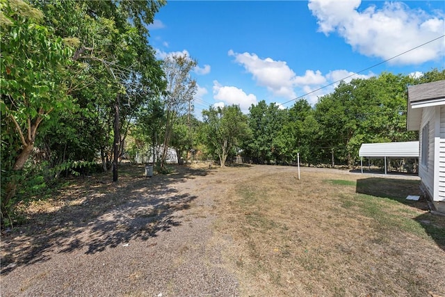 view of yard with a carport