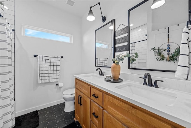 bathroom featuring tile patterned floors, vanity, toilet, and a shower with curtain