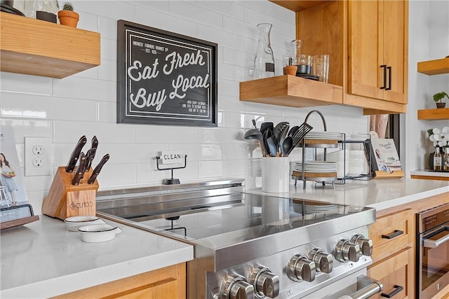 kitchen featuring appliances with stainless steel finishes and backsplash