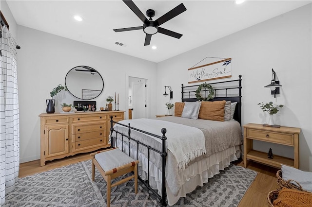 bedroom with ceiling fan and light wood-type flooring