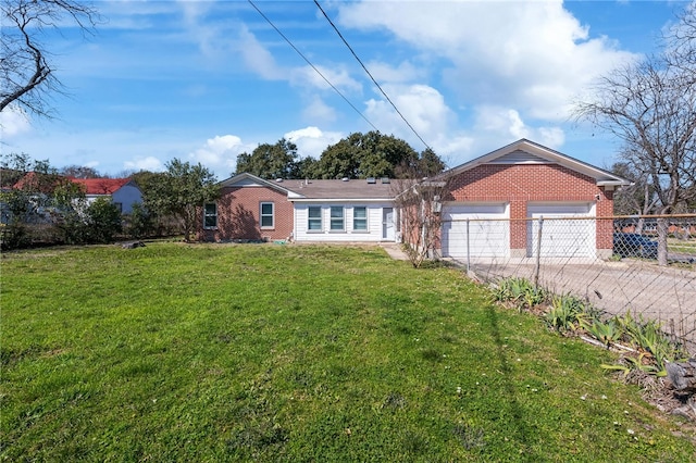 single story home with a garage and a front lawn