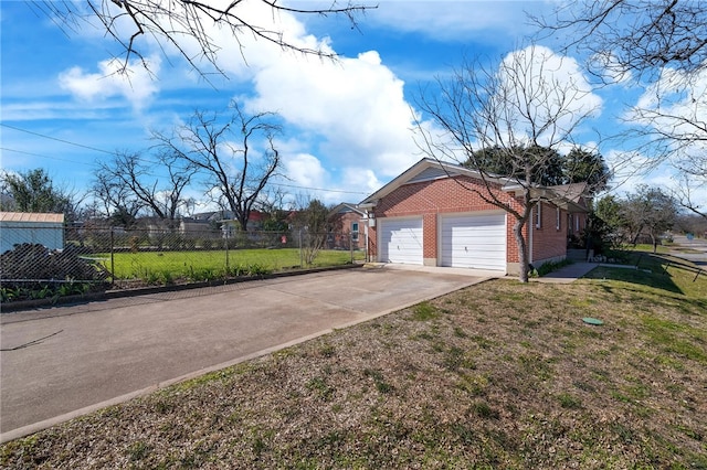 garage featuring a lawn